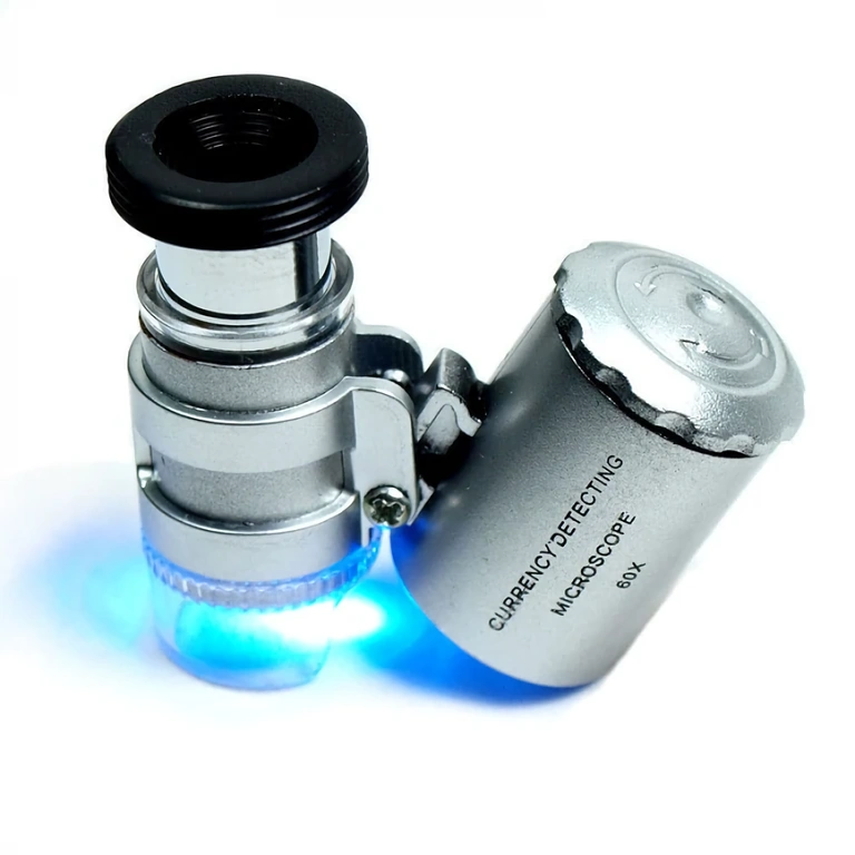 Microscópio com detector UV para identificação de cédulas falsas